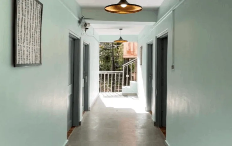 A quiet corridor opening onto the forest at the far end